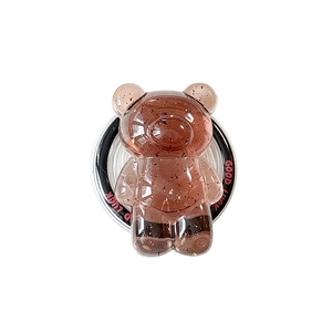 Bear-shaped phone stand in amber resin with gold foil and Good Luck engraving