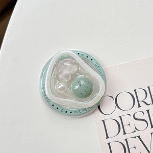 Detail of magnetic phone socket featuring gems and a Gift For You engraving