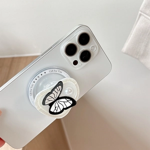 Elegant butterfly phone socket with faux pearl and black wings on white smartphone
