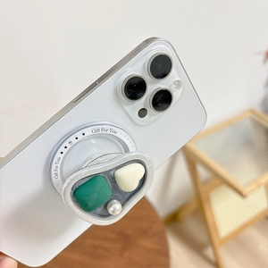 Vista laterale dettagliata del supporto magnetico per telefono con gemma, perla e spessore