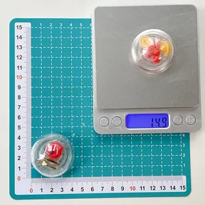 Macro view showing 14.9g weight measurement and dimensions of the red phone grip