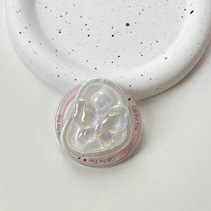 Detailed view of iridescent butterfly phone socket with rhinestone on ceramic plate