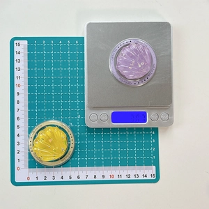 Detailed view of colorful shell phone grips with glitter and weight measurement