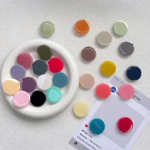 Minimalist round glossy acrylic cell phone socket grip in vibrant solid colors
