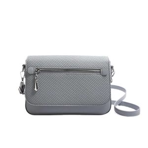 Gray crossbody bag featuring woven texture flap and smooth leather patchwork design