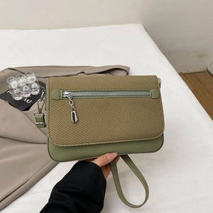 Olive green small crossbody bag with woven texture flap and adjustable shoulder strap