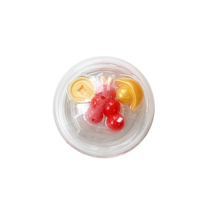 Transparent spherical phone grip with red berries, gold coins and sycee interior