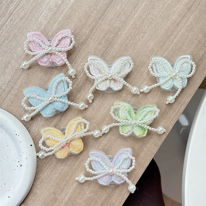 Pastel embroidered butterfly phone sockets with pearl bow accents in six soft colors