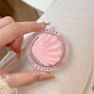 Close-up of pink pearlescent shell magnetic phone stand with Gift For You text