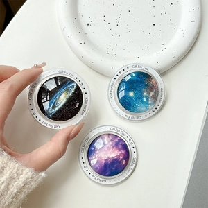 Three magnetic starry sky phone grips with Gift For You print on white desktop