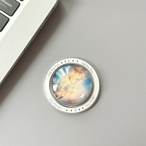 Macro shot of galaxy nebula pop grip with transparent glass dome and gift text