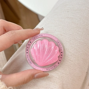 Detail of pink shell MagSafe phone grip with glitter finish and Gift For You engraving
