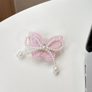 Detailed view of pink lace butterfly phone socket with pearl bow and tassel details