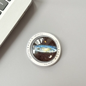 Detailed close-up of cosmic starry glass phone grip with Gift For You print on white border