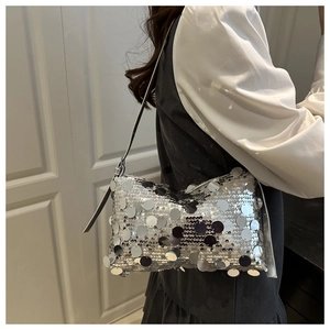 Silver sequin shoulder bag shown in a side-view outfit for party fashion styling