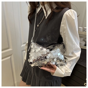 Silver oversized sequin shoulder bag shown on model for daily lifestyle outfit