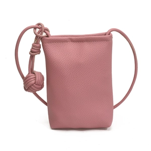 Pink lychee texture leather mini crossbody phone bag with stylish knotted shoulder strap