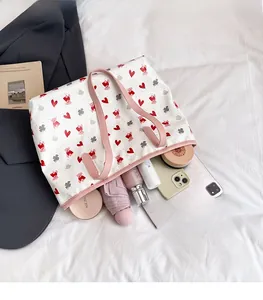Interior view of large capacity white bear tote bag showing storage for tablet and umbrella