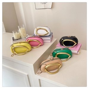 Minimalist pillow bags with large gold metal ring handles in six assorted vibrant colors