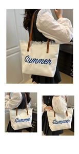 Detail of the Summer embroidery and raw fringe edges on this canvas tote bag