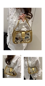 Detail of shimmering gold sequin handbag with metallic clasp and leather trim