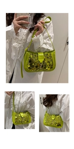 Close-up of vibrant sequin crossbody bag with golden hardware and adjustable strap
