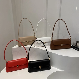 Five assorted minimalist leather baguette underarm bags with gold metal clasps and thin straps