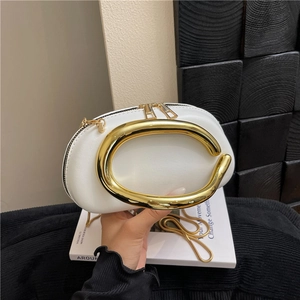 Minimalist white leather shoulder bag with designer gold metal handle and chain strap