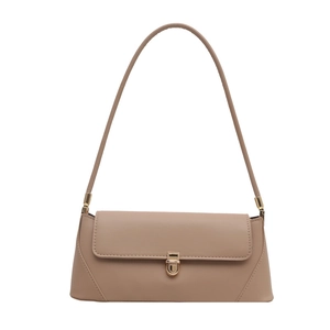Classic beige baguette shoulder bag with smooth leather finish and gold metal push-lock