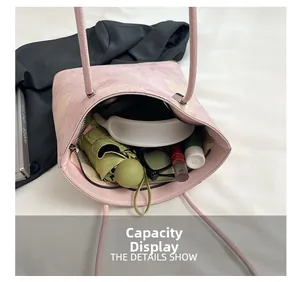 Pink floral tote bag showing large capacity for headphones, umbrella, and daily items