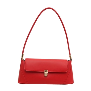 Chic red faux leather baguette shoulder bag with golden metal clasp on white background
