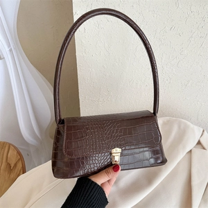 Brown crocodile embossed baguette shoulder bag with gold clasp and elegant slim strap