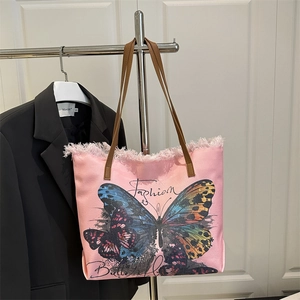 Grand sac cabas en toile rose avec broderie papillon et anses en cuir marron