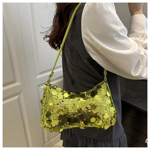 Detail of lime green sequin shoulder bag with reflective round sequins and leather strap