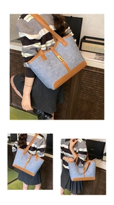 Detail of blue wool felt tote bag featuring brown leather trim and golden metal lock buckle