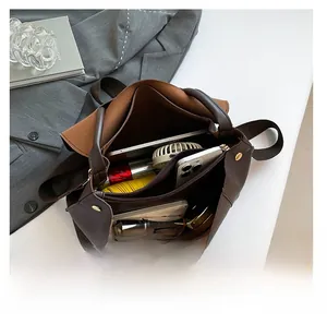 Top view of large tote bag interior showing multiple compartments and daily essentials