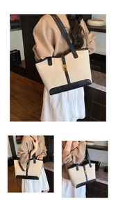 Detailed view of canvas tote bag with black leather trim and golden metal lock