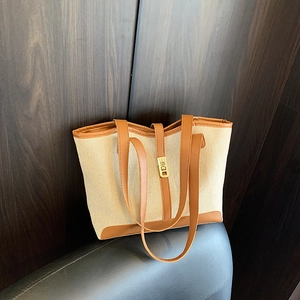 Retro canvas tote bag with brown leather trim and golden metal buckle for casual daily use