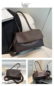 Detail of coffee brown PU leather tote bag showing magnetic flap and soft texture