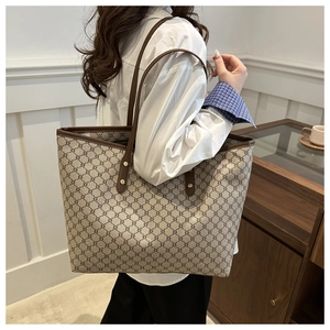 Chic retro geometric pattern tote bag shown with model in a minimalist indoor setting