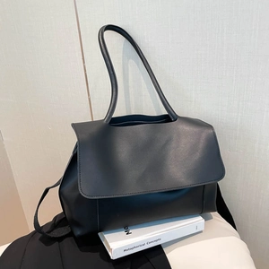 Minimalist black leather shoulder bag with flap cover for professional and daily style
