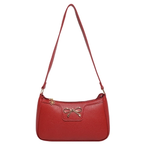 Red lychee pattern leather shoulder bag with gold bow decoration on white background