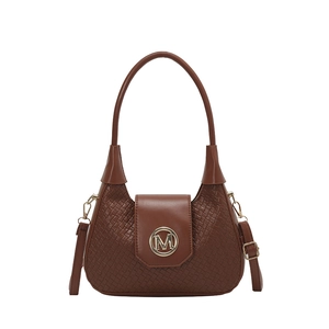 Brown woven crossbody bag with gold M logo and adjustable shoulder strap on white background
