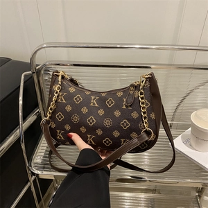 Retro brown monogram underarm bag with gold chain strap and floral print pattern