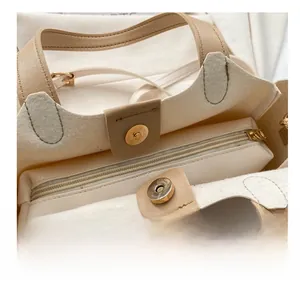 Détail du sac seau avec fermeture à fermoir magnétique et poche intérieure zippée sûre