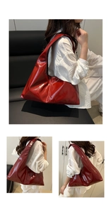 Detail view of red glossy soft leather hobo bag featuring stylish pleated design