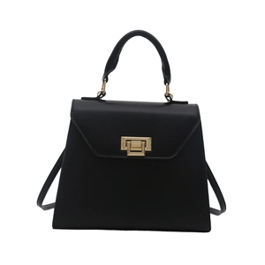 Elegant black matte leather handbag with gold metallic clasp and top handle for women