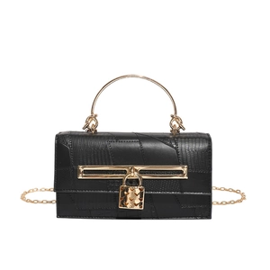 Vintage black crocodile embossed leather handbag with gold metal handle and chain strap