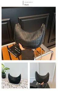 Close-up of black woven crescent bag with gold chain strap in minimalist retro style