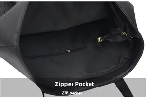 Détail de l'intérieur du sac cabas noir avec une poche zippée en métal doré sécurisée